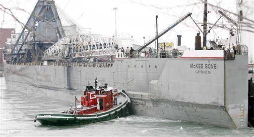 A view of a tugboats assisting a 579-foot McKee Sons freighter stuck in the Trenton Channel next to Grosse Ile, Mich., Sunday Dec. 26, 2010.